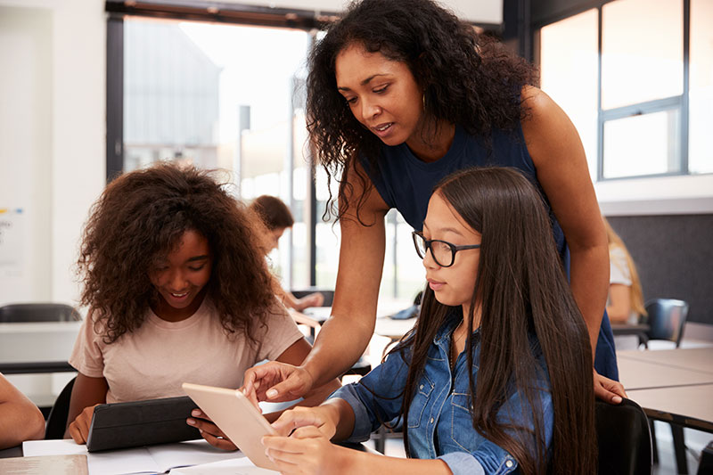 teacher with young students